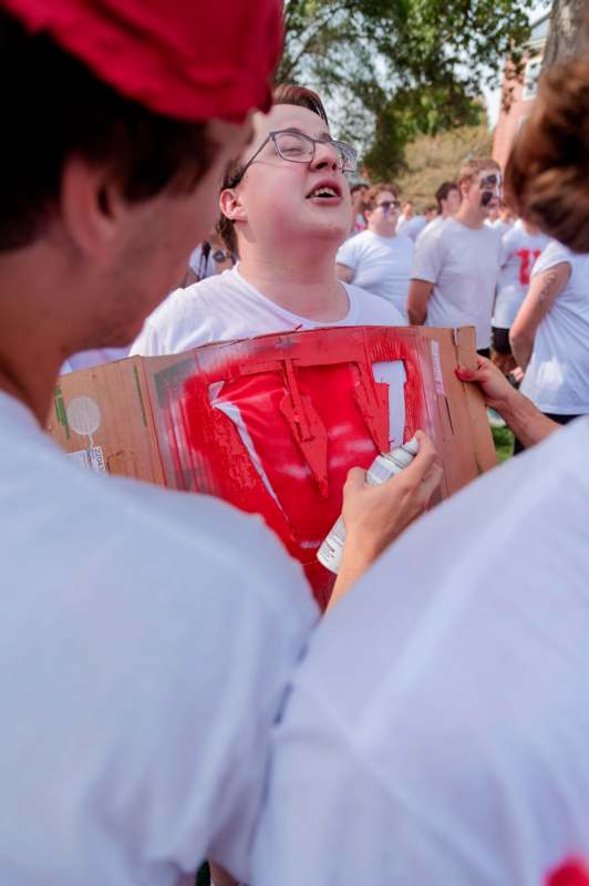 a group of people wearing white t-shirts