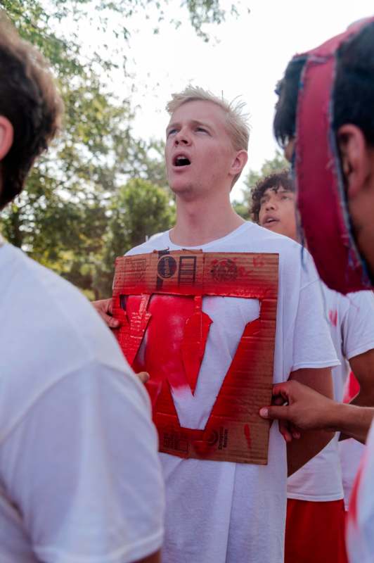 a group of people holding a sign