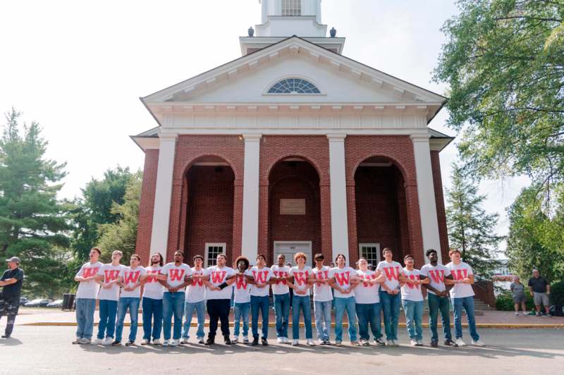 a group of people standing in front of a building