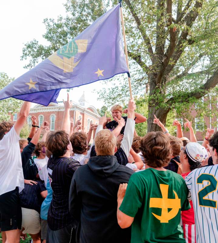 a group of people holding a flag