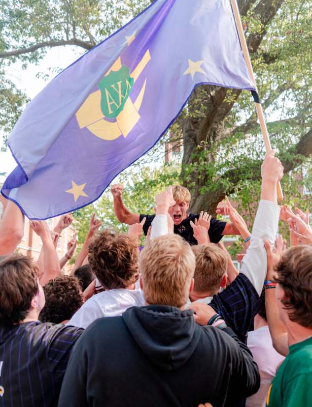 a group of people holding a flag