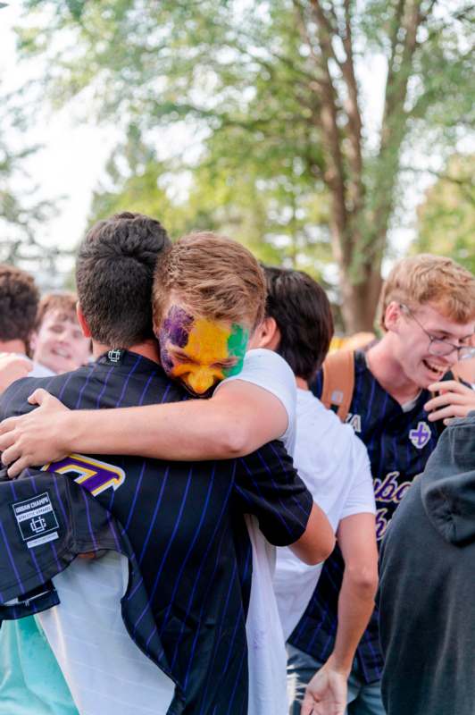 a group of people hugging each other