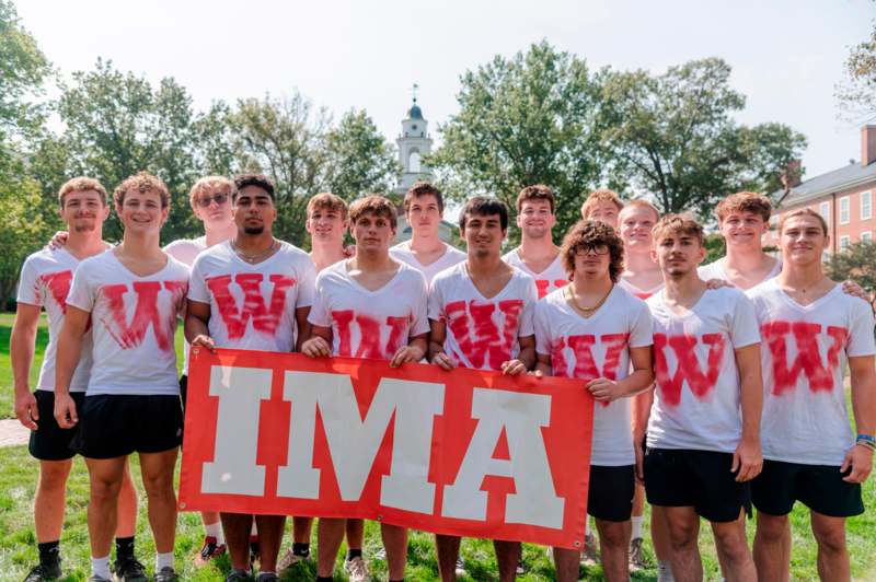 a group of people holding a banner