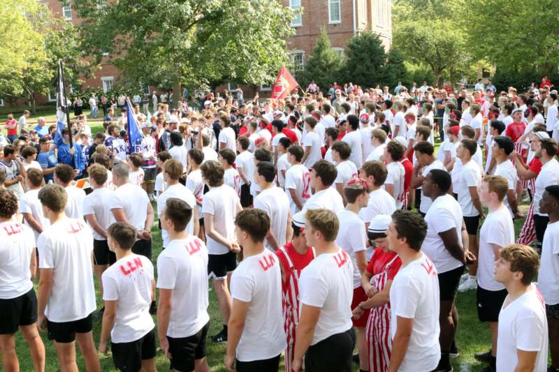 a large group of people in white shirts