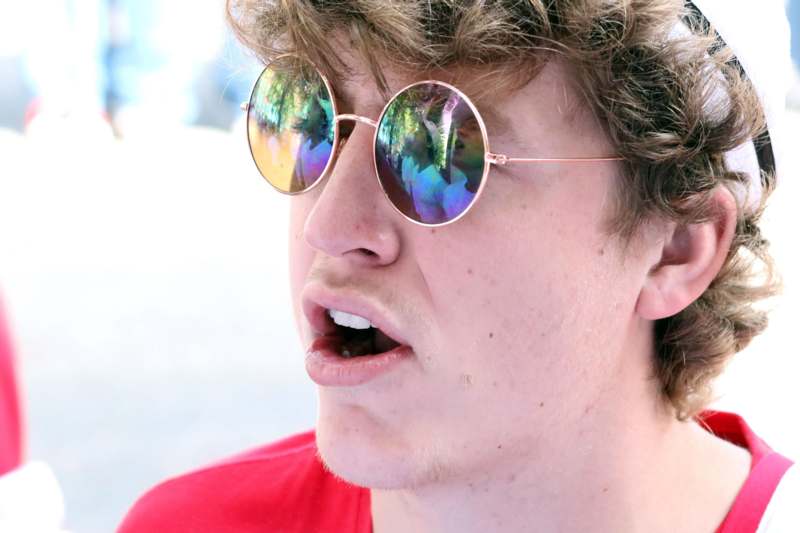 a man wearing sunglasses with his mouth open