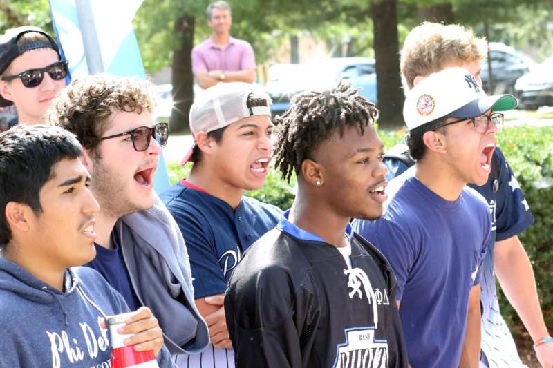 a group of men standing outside