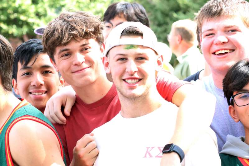 a group of young men smiling