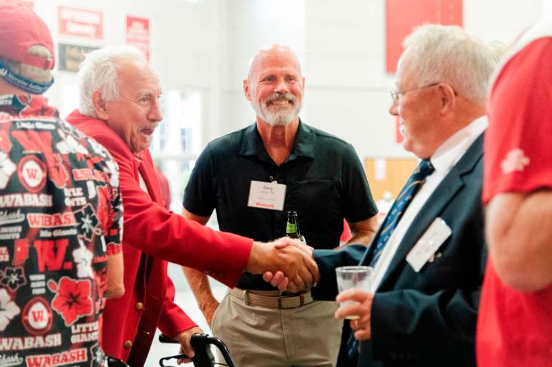 a group of men shaking hands