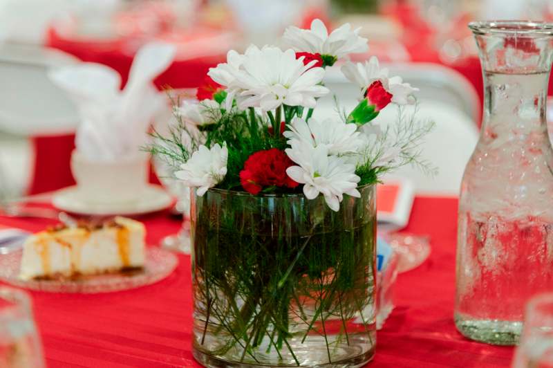 a glass vase with flowers on a table