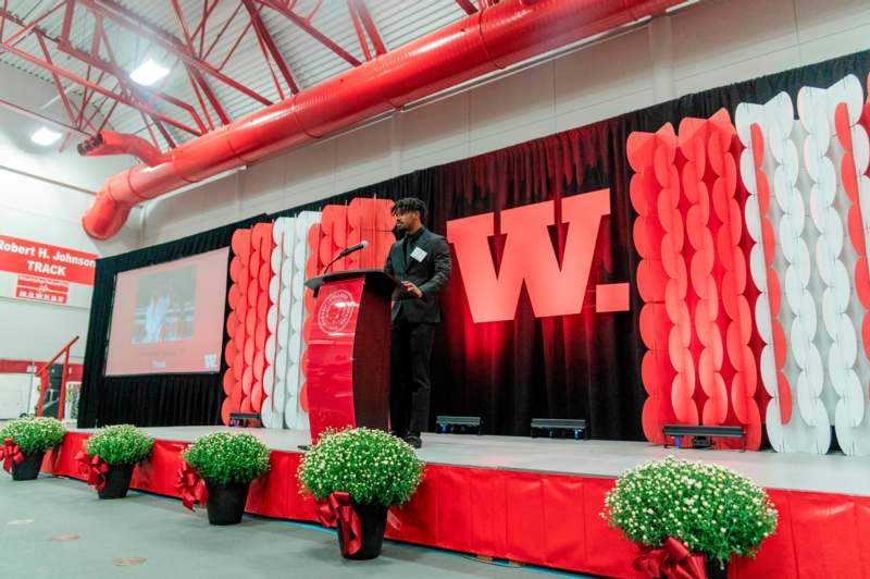 a man standing at a podium