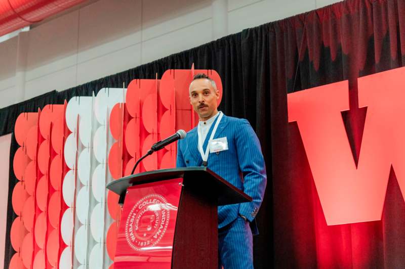 a man standing at a podium