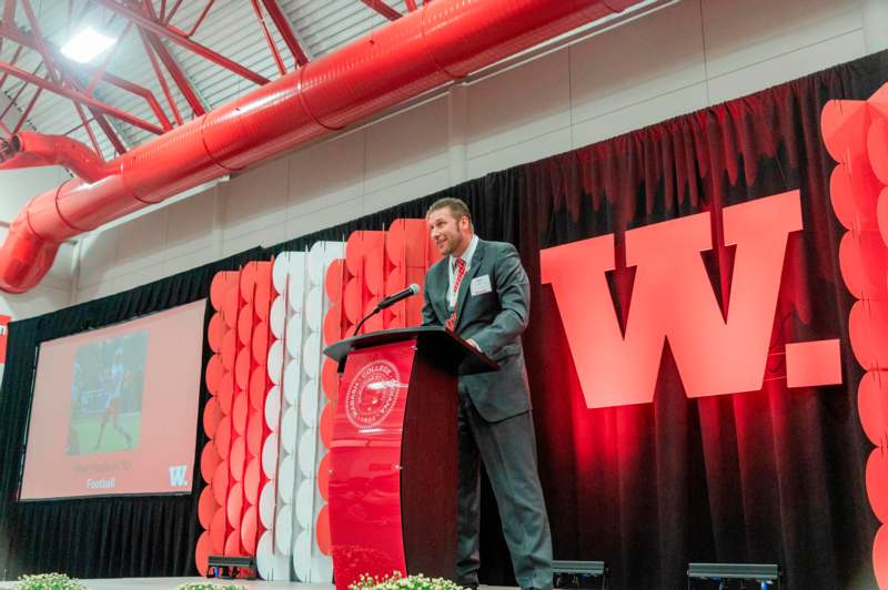 a man standing at a podium