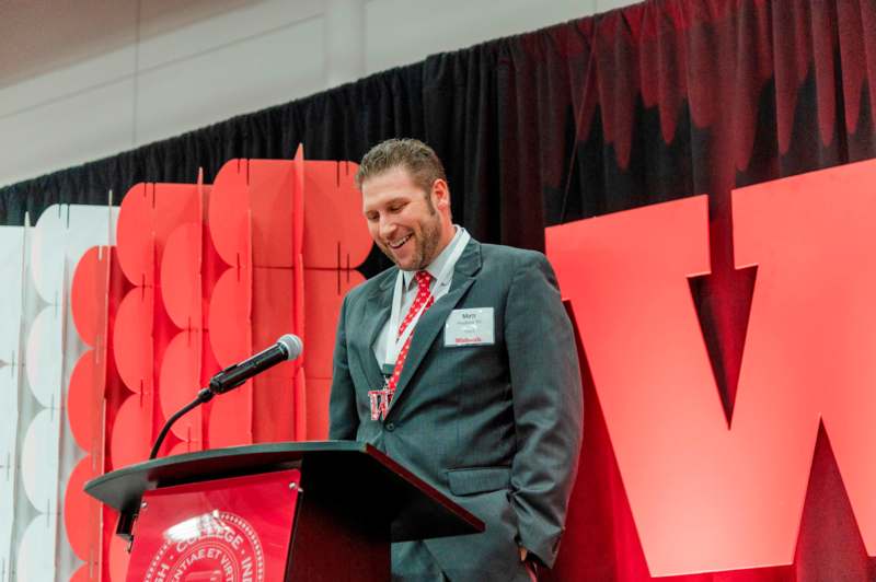 a man standing at a podium