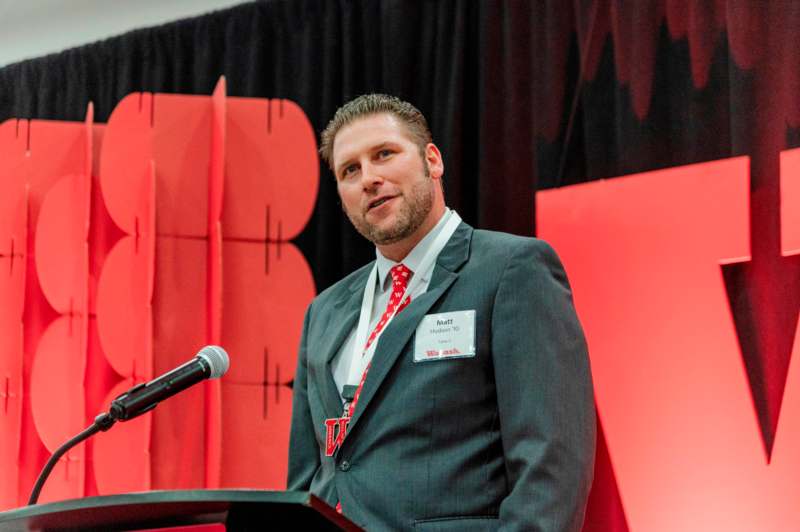 a man standing at a podium