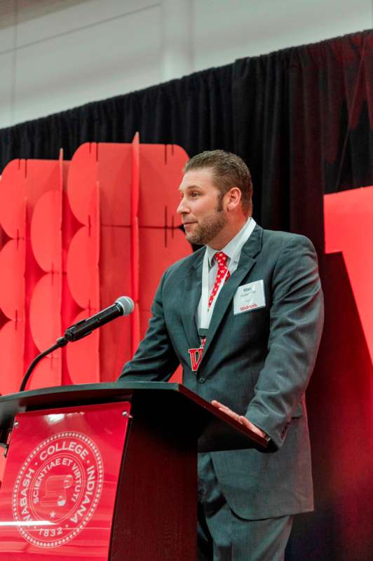 a man standing at a podium