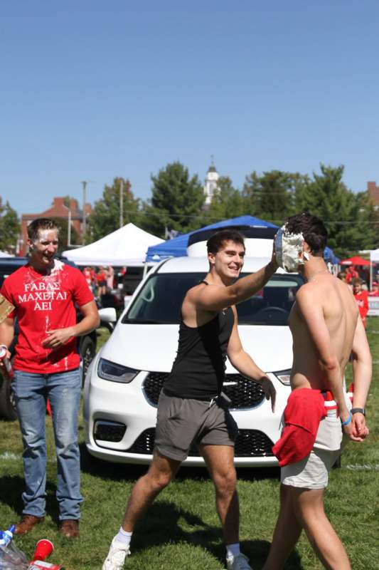 a group of men with cream on their face