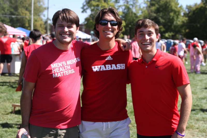 a group of men wearing red shirts