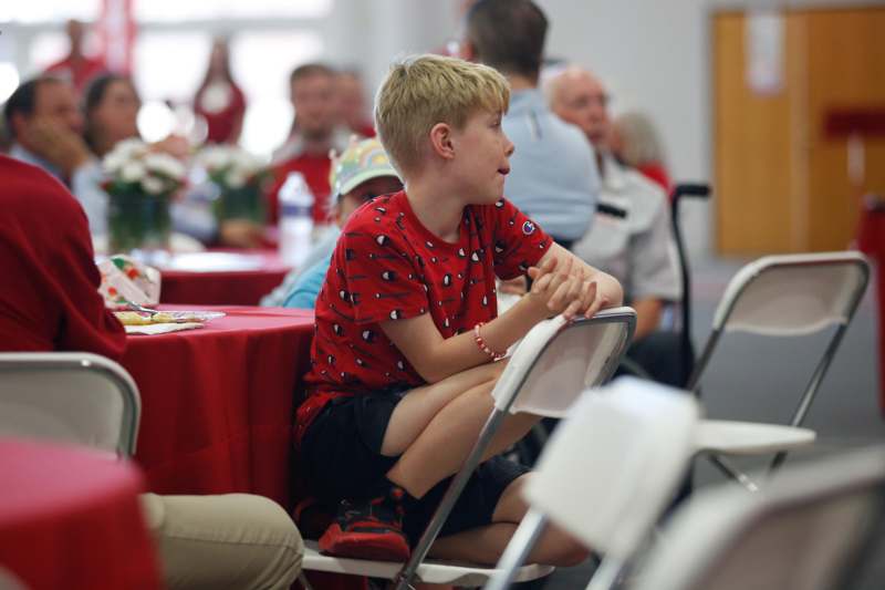 a boy sitting in a chair