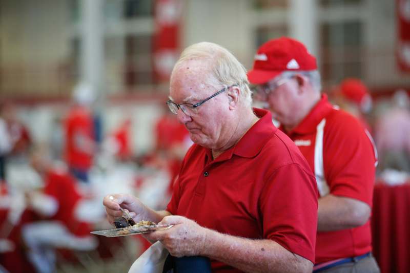 a man in red shirt eating