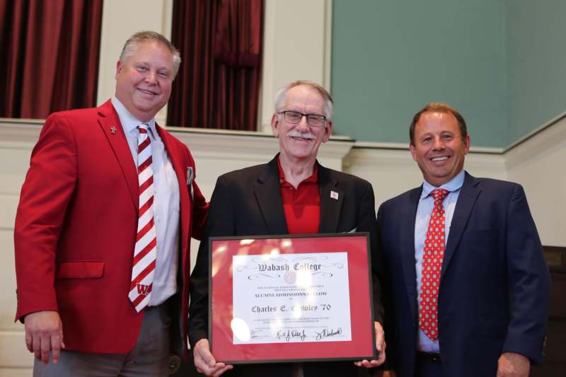 Charles Crowley poses with Jim Hawksworth and Scott Feller