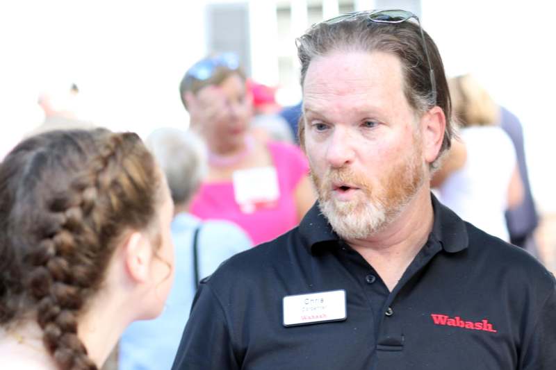 a man talking to a woman