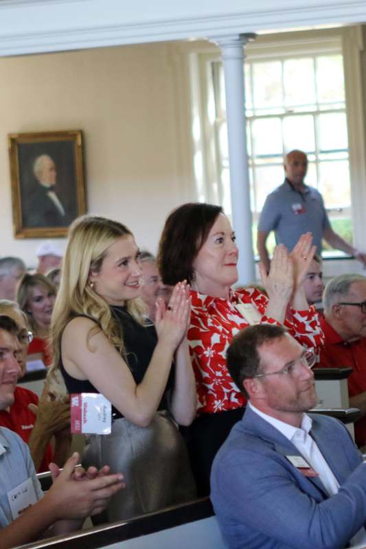 a group of people clapping