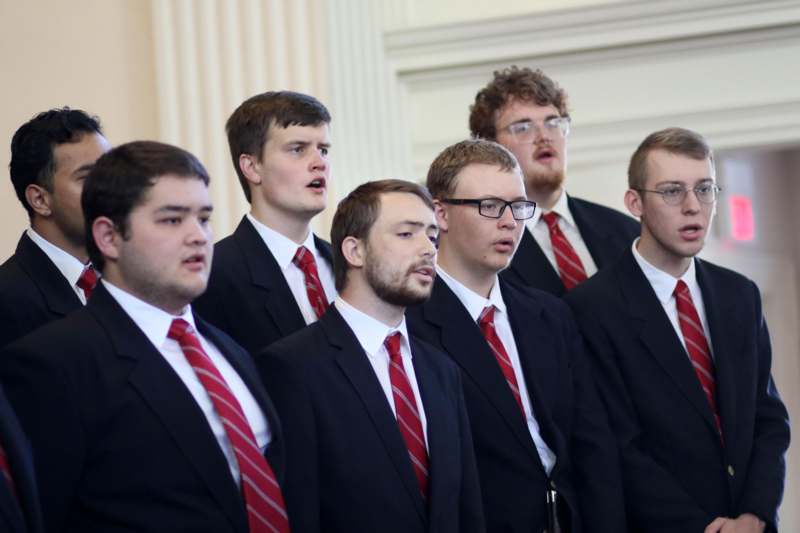 a group of men wearing suits and ties