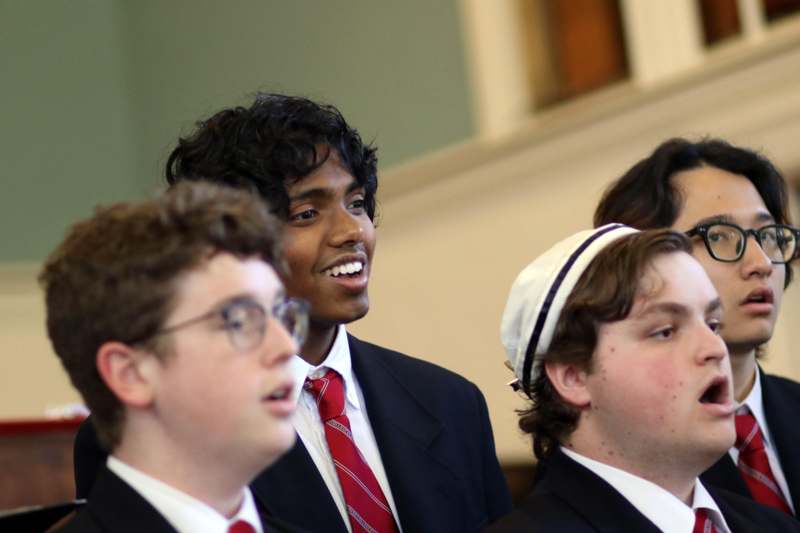 a group of young men in suits