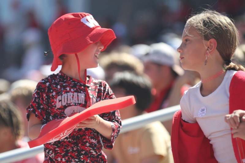 a boy and girl in red hats