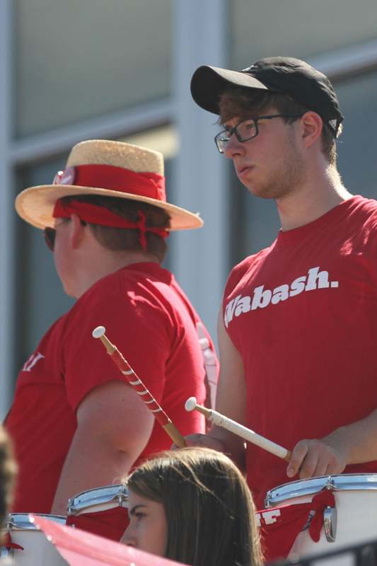 a group of men wearing red shirts