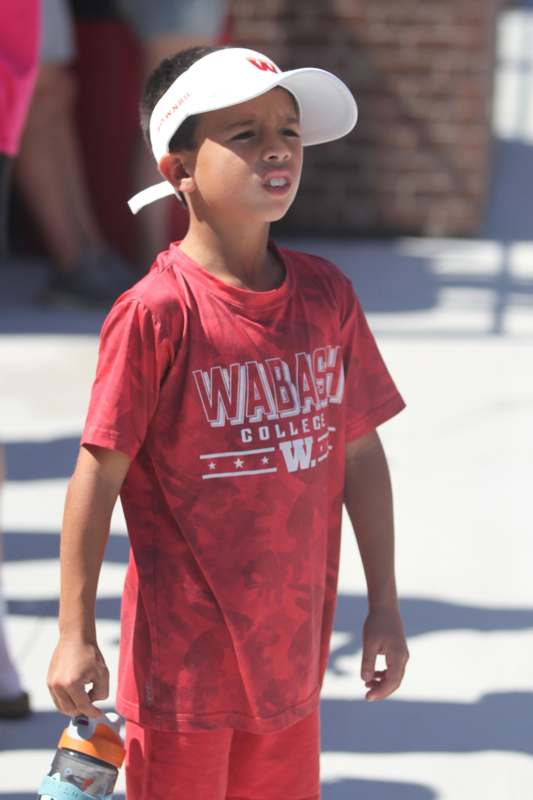 a boy wearing a white hat