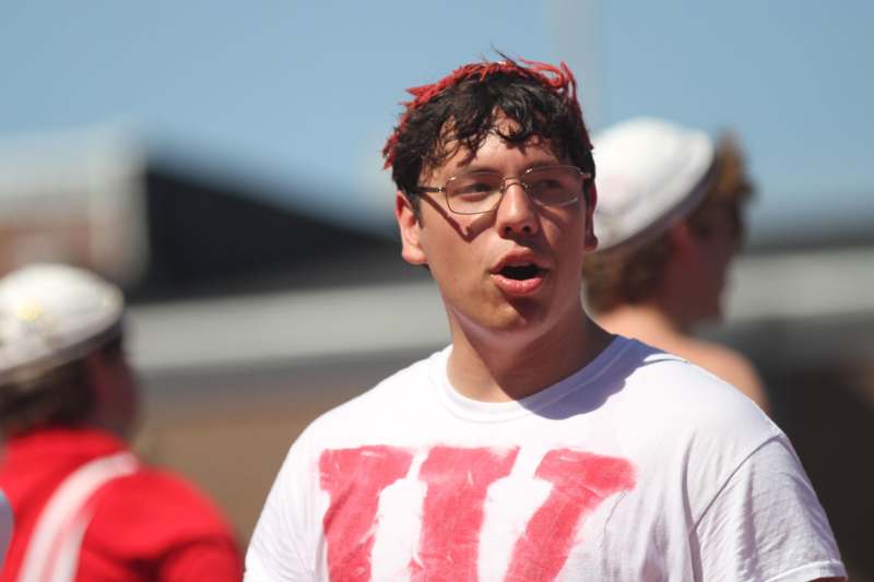 a man with red hair and glasses