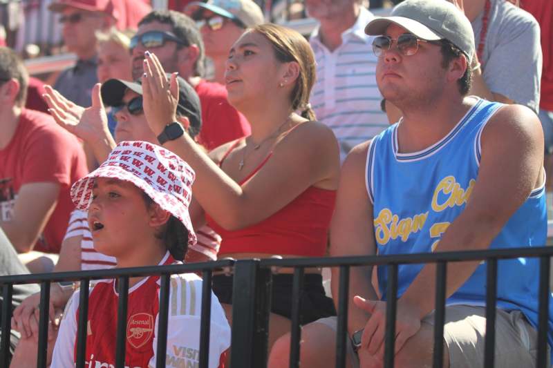 a group of people sitting in a stadium