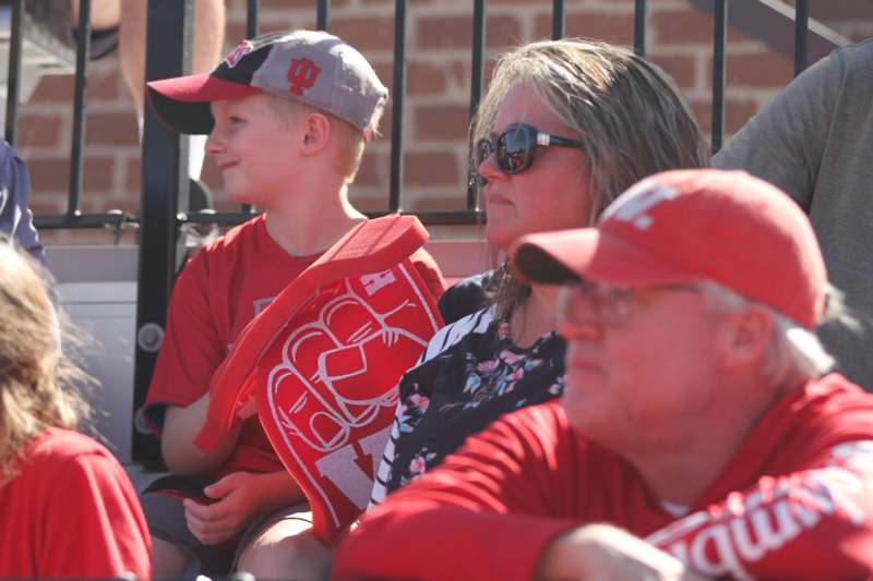 a group of people sitting in a stadium