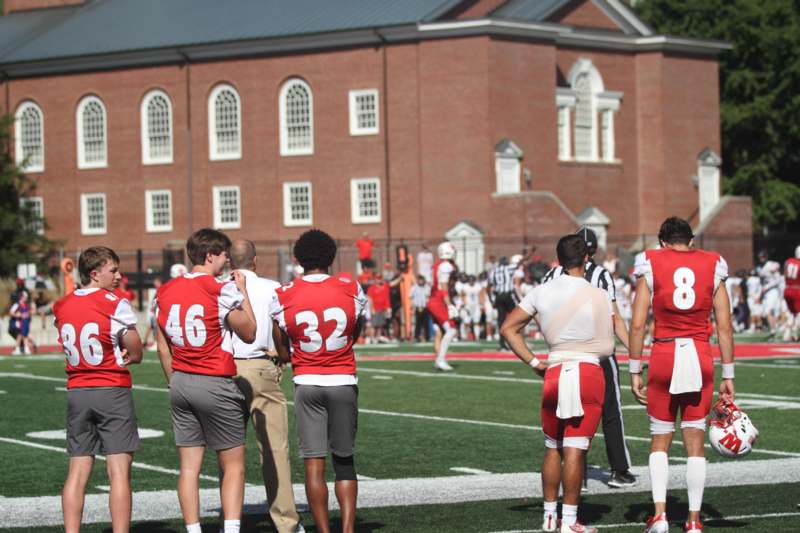 a group of people on a football field