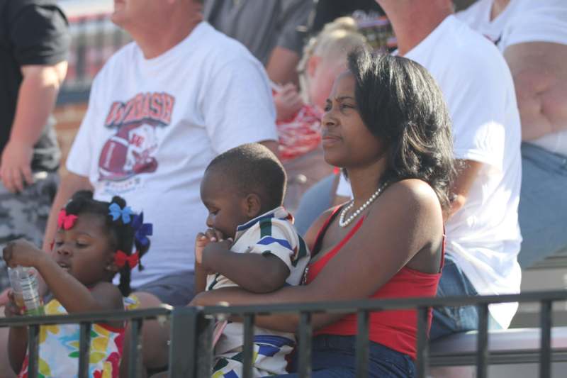 a woman holding a baby