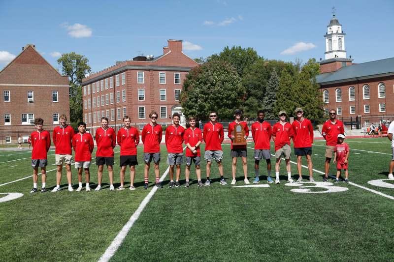 a group of people standing on a field