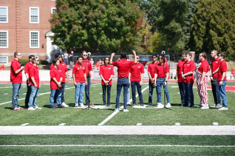 a group of people on a football field