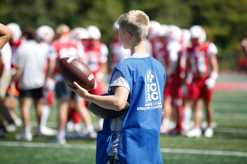 a boy holding a football