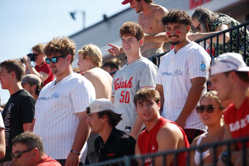 a group of people sitting in bleachers