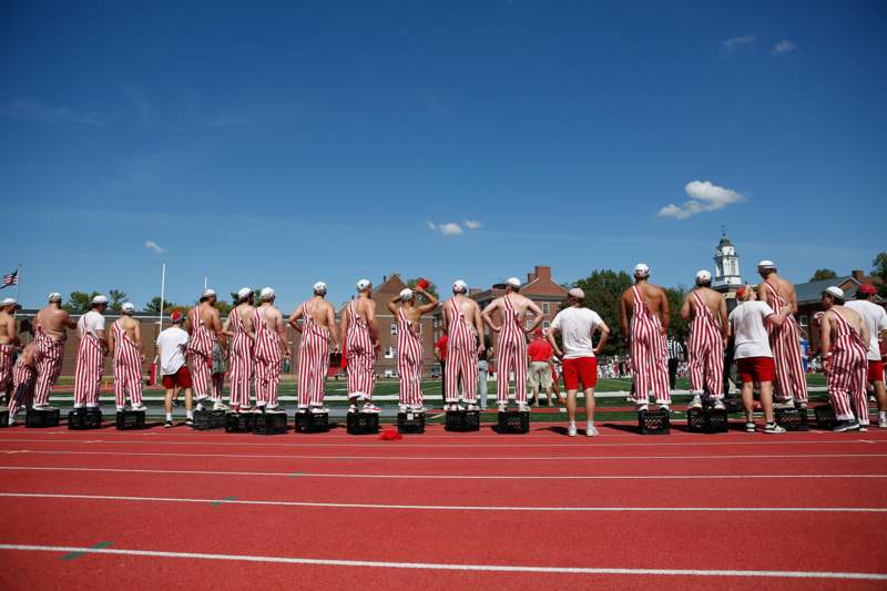 a group of people standing on a track