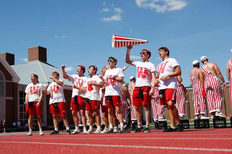 a group of people standing on a track