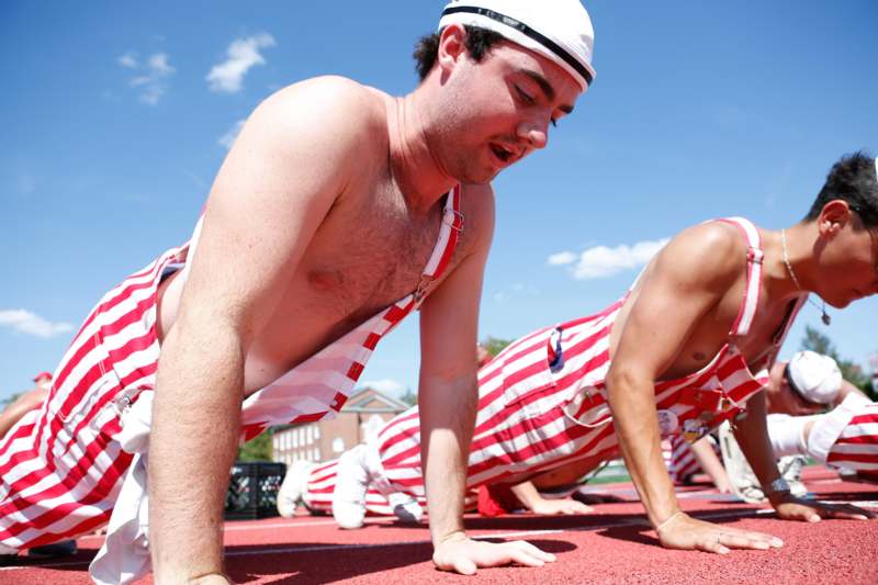 a group of men doing push ups