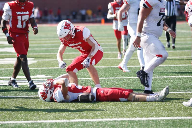 a football player falling on the ground