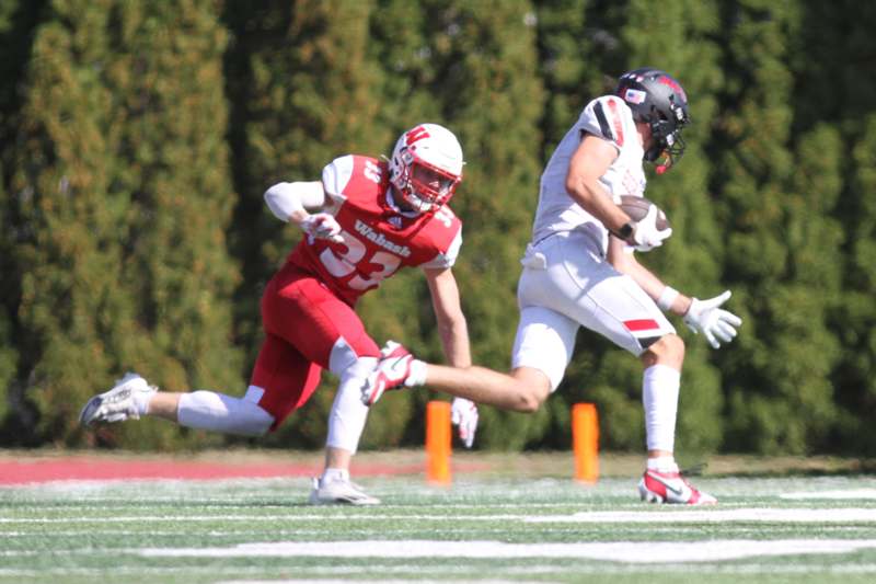 a football players running with the ball