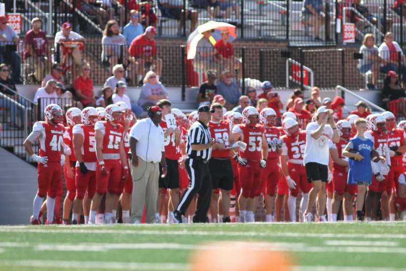 a football team standing on a field