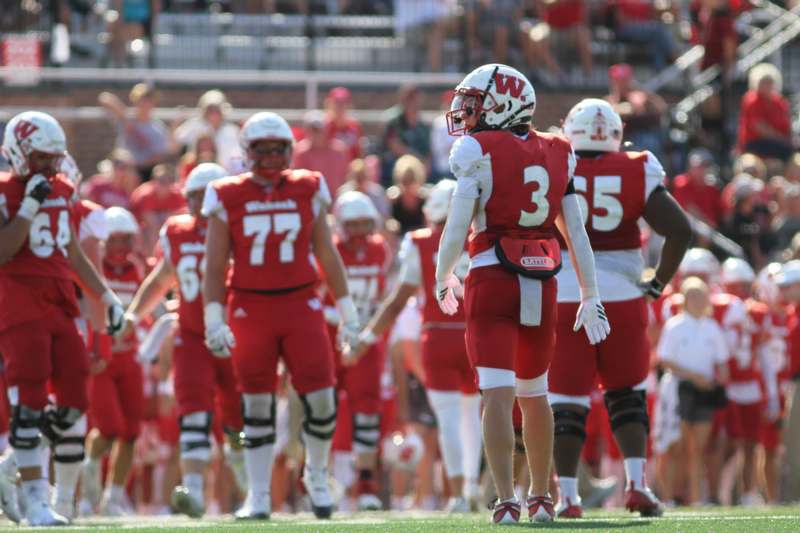 a group of football players on a field