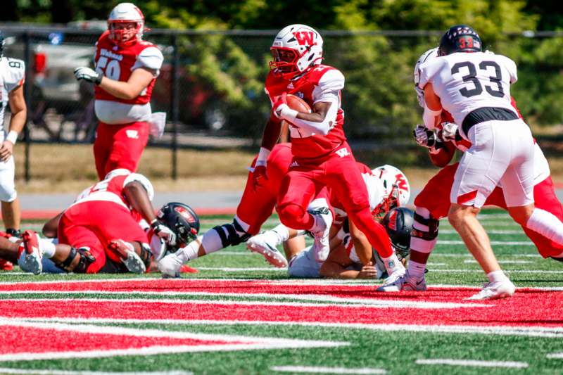 a football player running with the ball