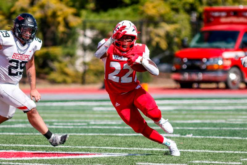 a football player running with the ball