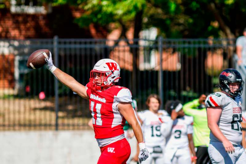 a football player catching a football